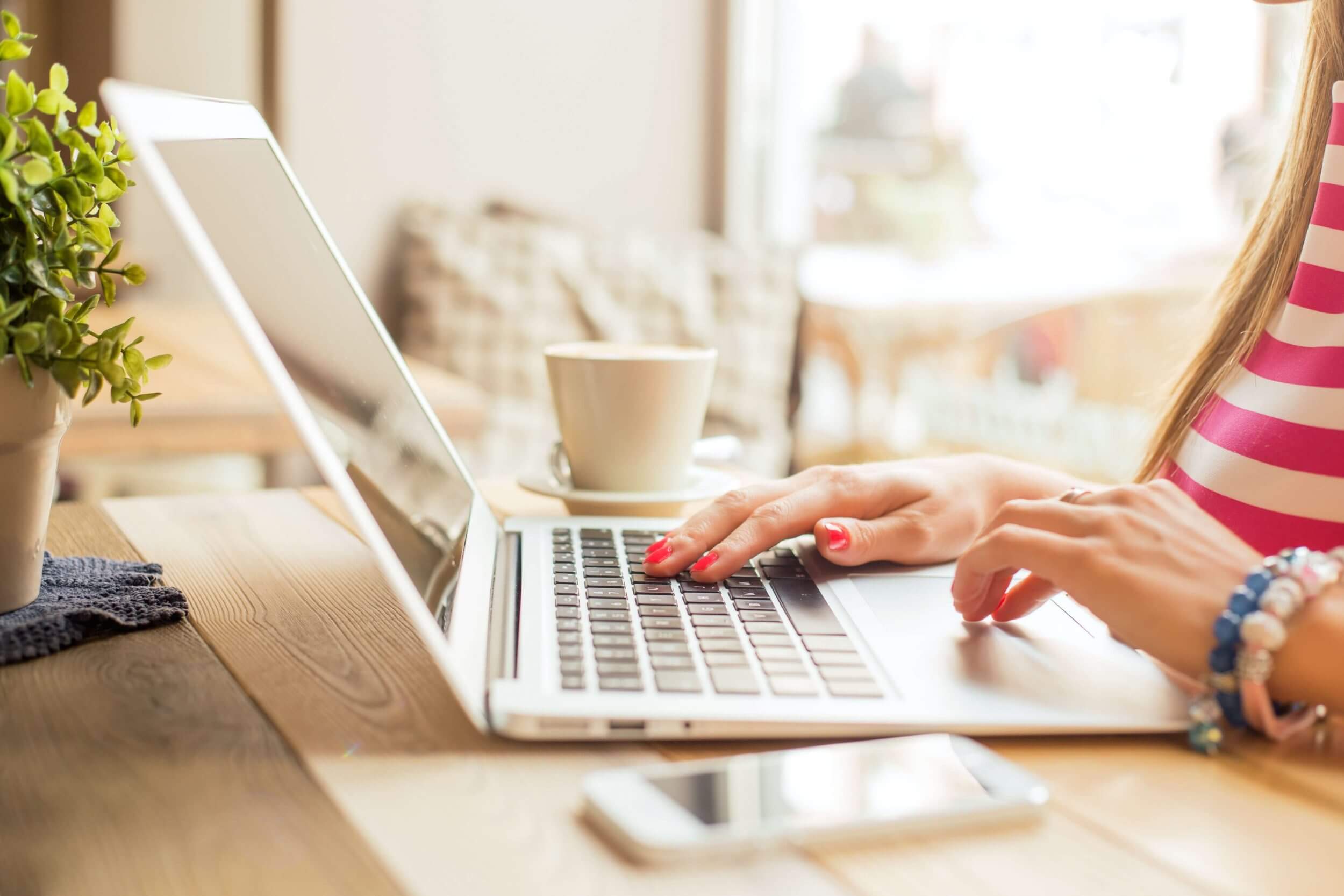 Woman typing on laptop