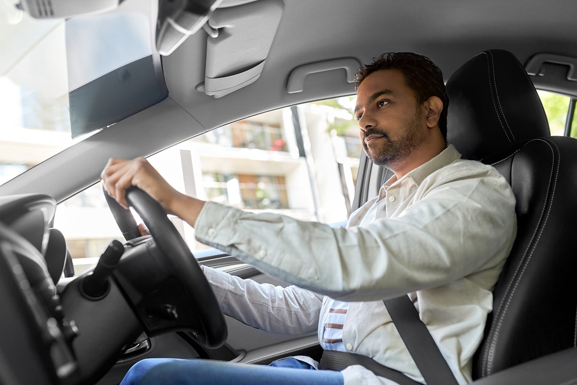 man driving car