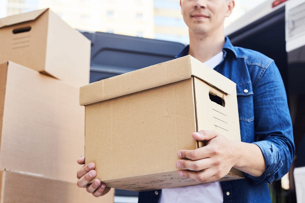 person moving boxes