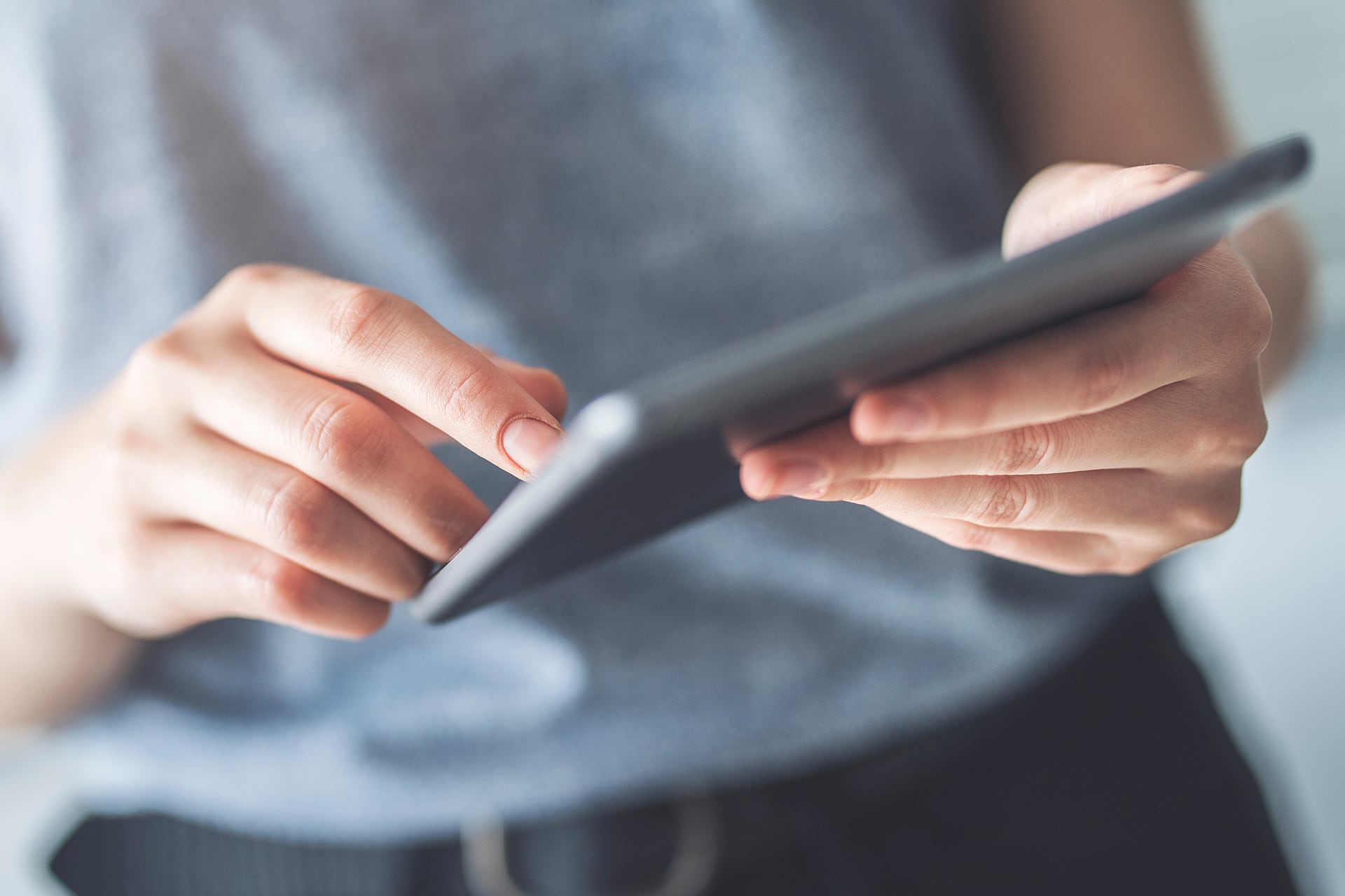 Someone holding a tablet device
